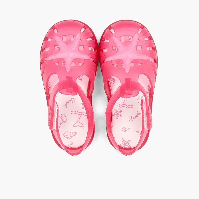 Jelly shoes with loop fasteners and a starfish Fuchsia