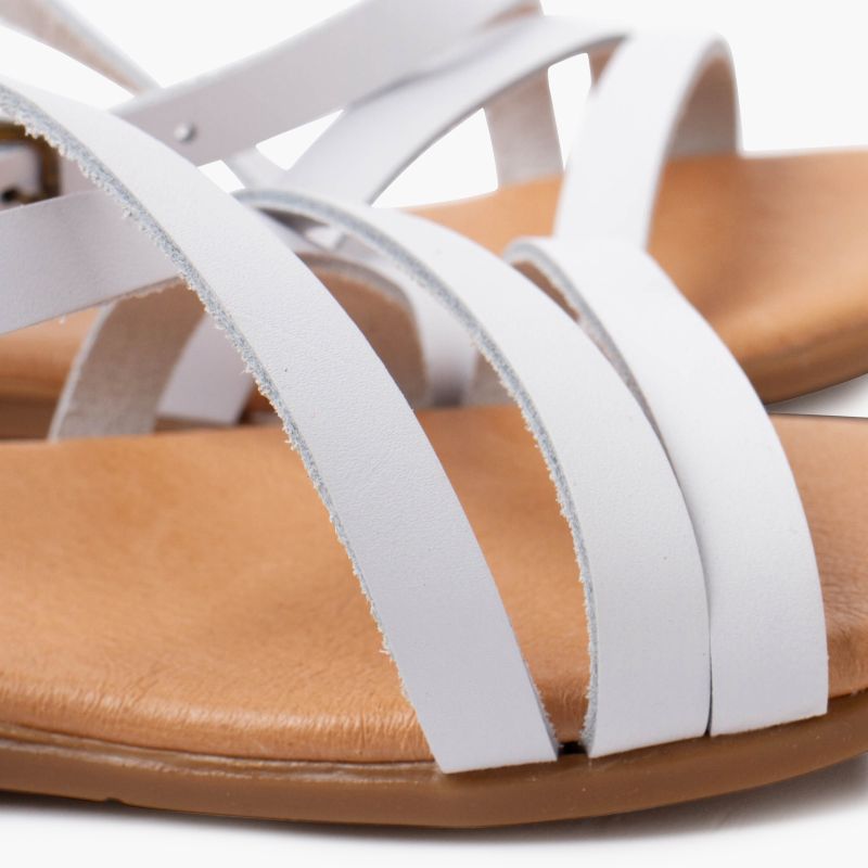 Girl's crossed strap sandals with buckle closure