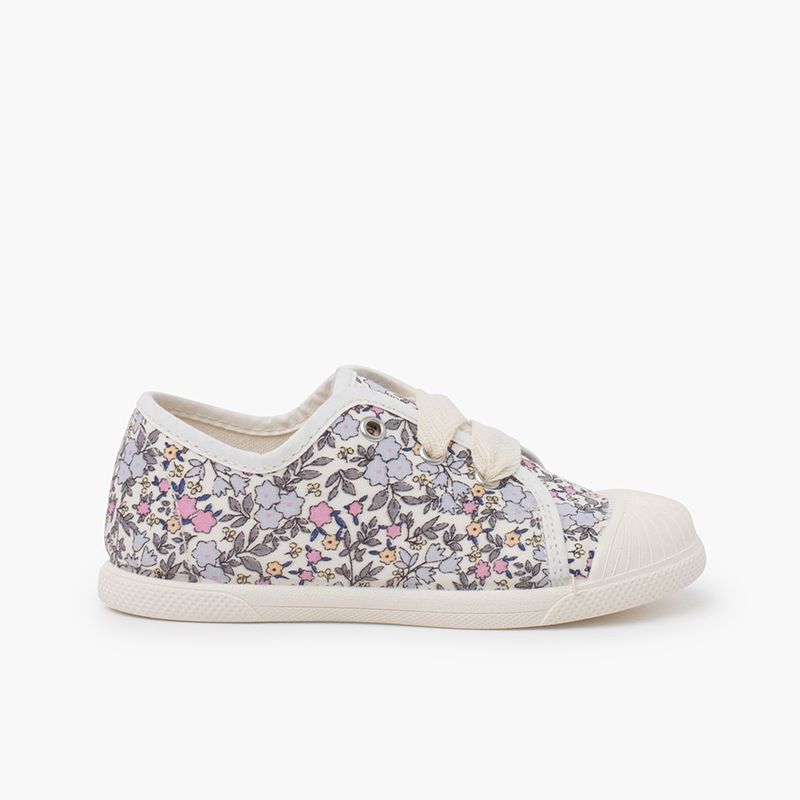 Rubber toe cap floral trainers