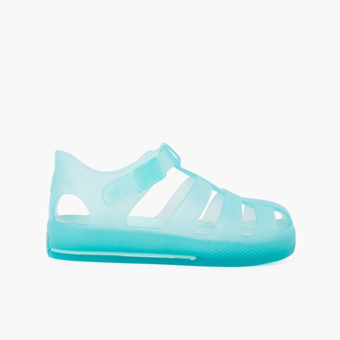 Tonal sole jelly sandals and clip button closure